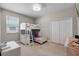 Bright bedroom featuring a bunk bed with a built-in ladder and storage, and a neutral color palette at 3332 Lone Cypress Pt, Oviedo, FL 32765