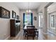 Cozy dining area featuring a wooden table set and natural light at 3332 Lone Cypress Pt, Oviedo, FL 32765