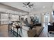 Bright and spacious living room with modern decor and an open floor plan, seamlessly connecting to the kitchen at 3332 Lone Cypress Pt, Oviedo, FL 32765
