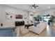 Comfortable living room with a ceiling fan, stylish furniture, and sliding doors leading to outdoor space at 3332 Lone Cypress Pt, Oviedo, FL 32765