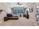 Relaxing main bedroom with a tray ceiling and view to the porch area at 3332 Lone Cypress Pt, Oviedo, FL 32765