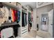 Well-organized walk-in closet with ample shelving, hanging space, drawers, and a full-length mirror at 3332 Lone Cypress Pt, Oviedo, FL 32765