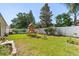 Well-maintained backyard featuring a wooden playset on a lush green lawn at 342 Hanging Moss Cir, Lake Mary, FL 32746