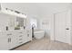 Bright bathroom features a double vanity, a soaking tub, and modern fixtures at 342 Hanging Moss Cir, Lake Mary, FL 32746