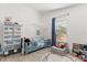Bright bedroom with a window, -sized bed, storage and fun decor at 342 Hanging Moss Cir, Lake Mary, FL 32746
