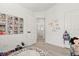 Bright bedroom featuring tile floors, white walls and a round alphabet rug at 342 Hanging Moss Cir, Lake Mary, FL 32746