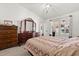 Charming bedroom features tile floors, a sliding door, and elegant furnishings at 342 Hanging Moss Cir, Lake Mary, FL 32746