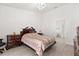 Cozy bedroom features tile floors, a chandelier, and elegant furnishings at 342 Hanging Moss Cir, Lake Mary, FL 32746