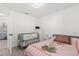 Bedroom featuring tile floors, a full-sized bed and a crib at 342 Hanging Moss Cir, Lake Mary, FL 32746