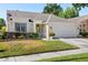 Charming one-story home featuring a manicured lawn and a two-car garage at 342 Hanging Moss Cir, Lake Mary, FL 32746