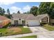 Charming one-story home featuring a manicured lawn and a two-car garage at 342 Hanging Moss Cir, Lake Mary, FL 32746