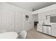 Bright kitchen features stainless steel appliances, white cabinets, tile floors, and walk-in pantry at 342 Hanging Moss Cir, Lake Mary, FL 32746