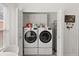 Bright laundry room featuring a side-by-side washer and dryer at 342 Hanging Moss Cir, Lake Mary, FL 32746