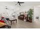Spacious living room features an open floor plan, tile floors, ceiling fans, and lots of natural light at 342 Hanging Moss Cir, Lake Mary, FL 32746