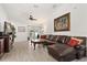 Comfortable living room featuring wood floors and a large sofa at 342 Hanging Moss Cir, Lake Mary, FL 32746