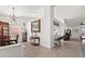 Inviting living space with wood floors and view into adjoining dining area at 342 Hanging Moss Cir, Lake Mary, FL 32746