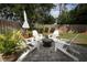 Backyard featuring patio area with seating around a fire pit and garden at 3562 Gatlin Pl, Orlando, FL 32812