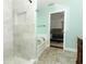 Bright bathroom features a separate shower and soaking tub, plus stylish tile and fixtures at 3562 Gatlin Pl, Orlando, FL 32812