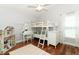 Bright bedroom with hardwood floors, bunk beds, a vanity, and lots of natural light at 3562 Gatlin Pl, Orlando, FL 32812