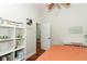 This bedroom offers a dedicated desk and ample storage in a calming setting at 3562 Gatlin Pl, Orlando, FL 32812
