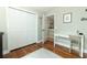 Spacious room with hardwood floors, a closet, and adjacent study area at 3562 Gatlin Pl, Orlando, FL 32812