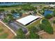 A community park features a splash pad, playground, sand volleyball court, and pavilion on a sunny day at 3562 Gatlin Pl, Orlando, FL 32812
