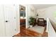 Second floor hallway with a cozy reading nook and views of the adjacent bedroom at 3562 Gatlin Pl, Orlando, FL 32812