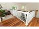 Second floor landing features hardwood floors and views of the lower level at 3562 Gatlin Pl, Orlando, FL 32812