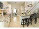 Well-designed kitchen with granite countertops, stainless steel appliances, and a breakfast bar with seating at 3562 Gatlin Pl, Orlando, FL 32812