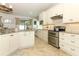 Inviting kitchen featuring granite countertops, stainless appliances, and abundant cabinetry for storage at 3562 Gatlin Pl, Orlando, FL 32812