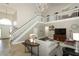 Bright living room with high ceilings, a staircase, and comfortable seating at 3562 Gatlin Pl, Orlando, FL 32812