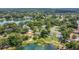 An aerial view of neighborhood homes, mature trees and lakes create a serene, natural setting at 3605 Pershing Ave, Orlando, FL 32812
