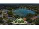 Aerial view highlighting a home's property lines and proximity to a scenic lake at 3605 Pershing Ave, Orlando, FL 32812