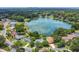 Aerial view showcasing a home's location near a lake with lush greenery and residential surroundings at 3605 Pershing Ave, Orlando, FL 32812