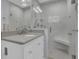 Modern bathroom with glass-enclosed shower, stone countertop and updated fixtures at 3605 Pershing Ave, Orlando, FL 32812