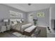 Bright bedroom featuring multiple windows for natural light, accompanied by tasteful furnishings and decor at 3605 Pershing Ave, Orlando, FL 32812