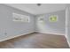 Neutral bedroom with hardwood floors and two windows providing natural light at 3605 Pershing Ave, Orlando, FL 32812