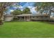 Charming single-story home with mature trees and a well-manicured lawn at 3605 Pershing Ave, Orlando, FL 32812