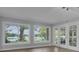 Sunny living room with large windows providing views of the lake at 3605 Pershing Ave, Orlando, FL 32812