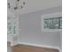 Bright and open living room featuring hardwood floors and a window at 3605 Pershing Ave, Orlando, FL 32812
