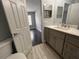 Bathroom featuring nice vanity with marble countertop, leading to the bedroom at 3807 Atrium Dr, Orlando, FL 32822