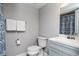 Cozy bathroom featuring a toilet, sink, and a shower with a patterned curtain at 3807 Atrium Dr, Orlando, FL 32822