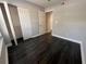 Bright bedroom with wood floors and a closet with shelving at 3807 Atrium Dr, Orlando, FL 32822