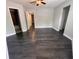 Bedroom featuring dark wood flooring, ceiling fan and lighting at 3807 Atrium Dr, Orlando, FL 32822