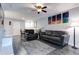 Combination living and dining area featuring stylish gray floors and modern decor at 3807 Atrium Dr, Orlando, FL 32822