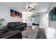 Comfortable living room featuring modern decor, a ceiling fan, and sliding glass doors to the outside at 3807 Atrium Dr, Orlando, FL 32822