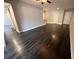 Spacious living room with dark wood floors, neutral wall paint and great natural light at 3807 Atrium Dr, Orlando, FL 32822