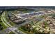 Aerial view of a Primary planned community showing shopping centers, new construction, and surrounding neighborhoods at 3824 Bluethread Way, Poinciana, FL 34759
