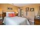 Comfortable bedroom with a modern bed, and bedside tables with fishing decor, offering a relaxing and inviting retreat at 3828 Bluethread Way, Poinciana, FL 34759