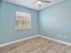 Light and airy bedroom with wood floors and ample natural light at 4469 Biscayne Breeze Way, Kissimmee, FL 34744